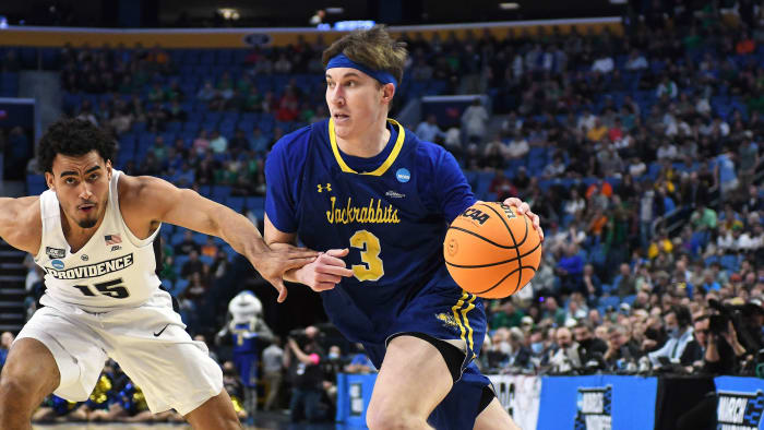 Baylor Scheierman dribbles while with South Dakota State